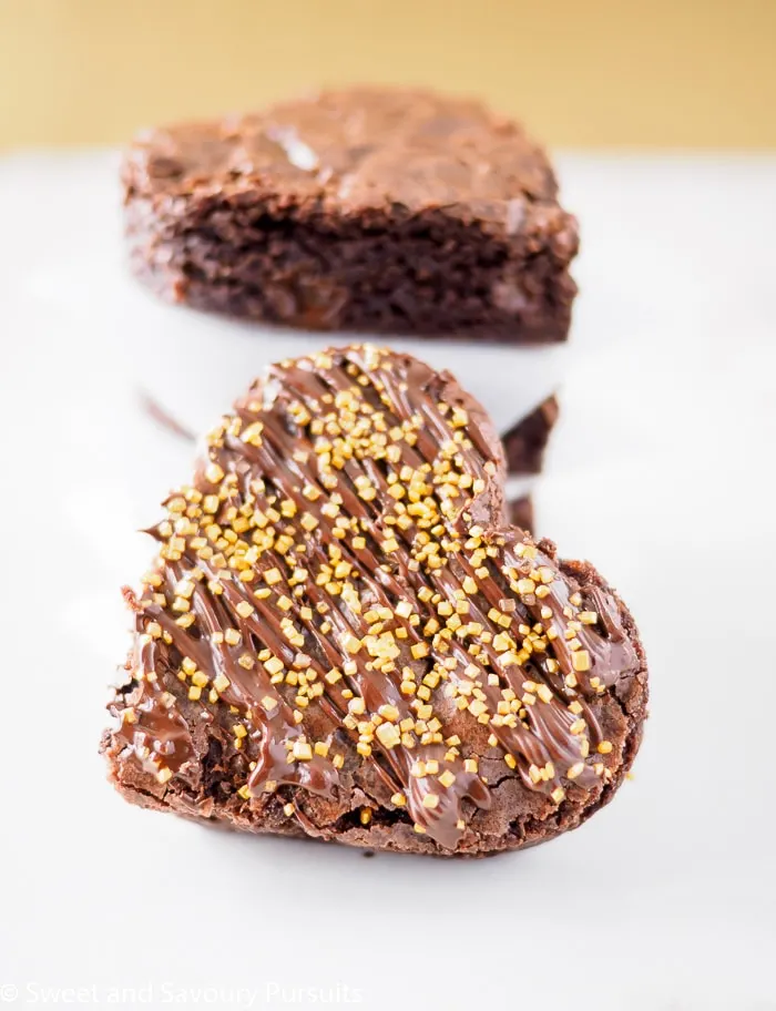 Close-up of a spicy brownie cut into heart shape.