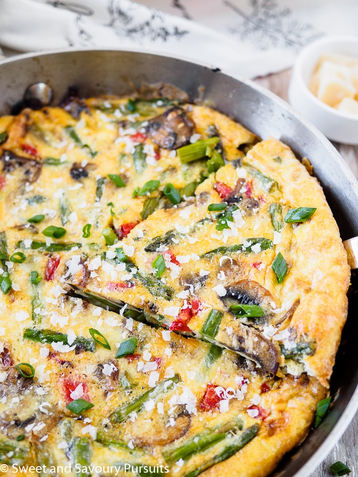 Vegetable frittata with cut slice.