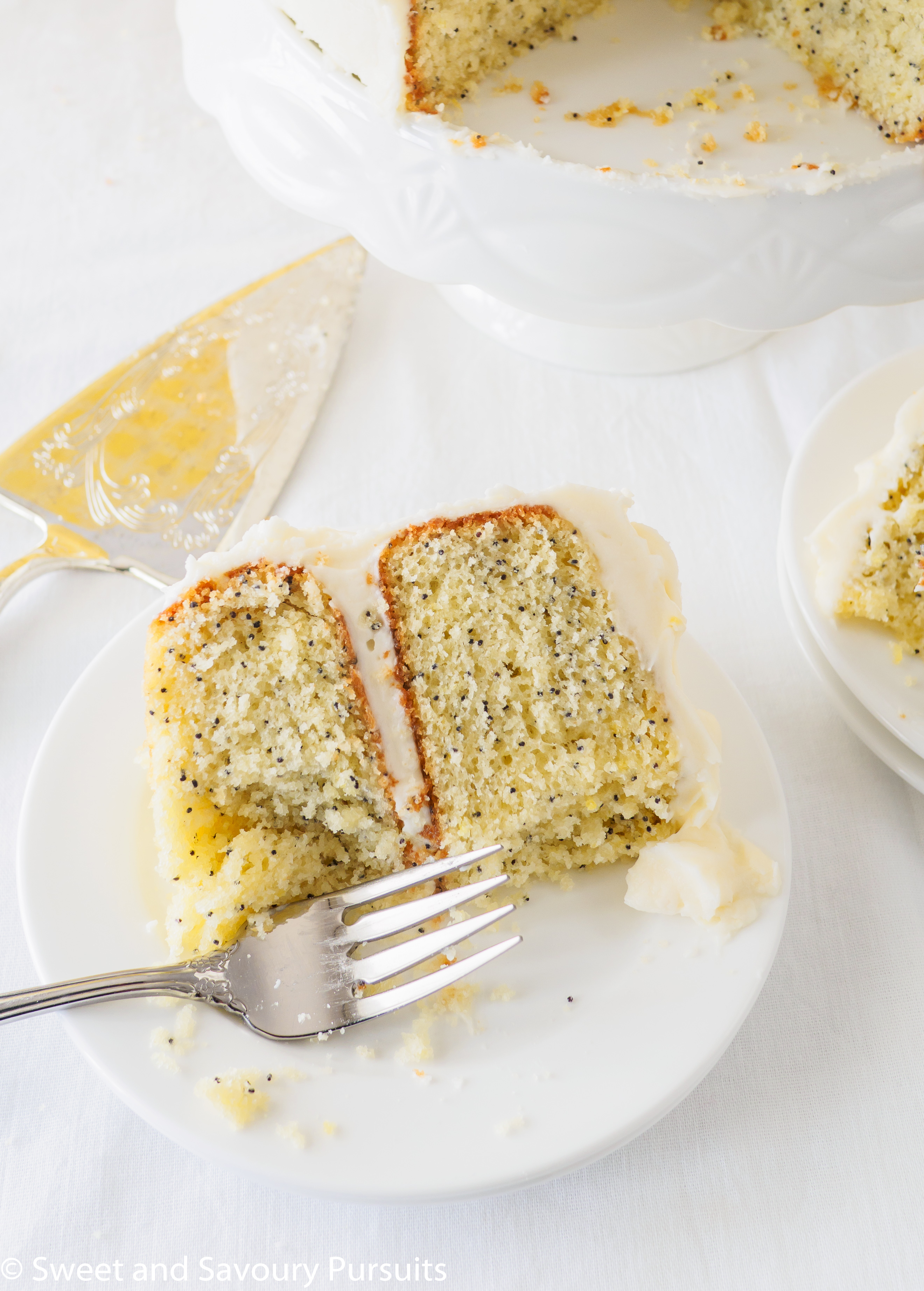 Slice of lemon cake on dish.