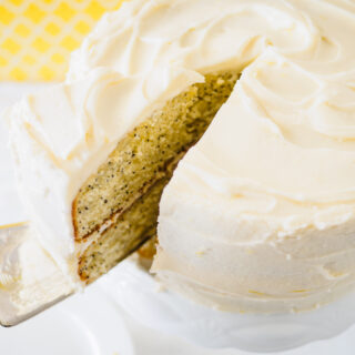 A close-up of a lemon flavoured cake with cream cheese frosting