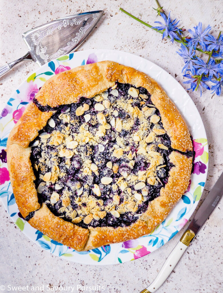 A Blueberry Almond Crumble Galette on a plate.