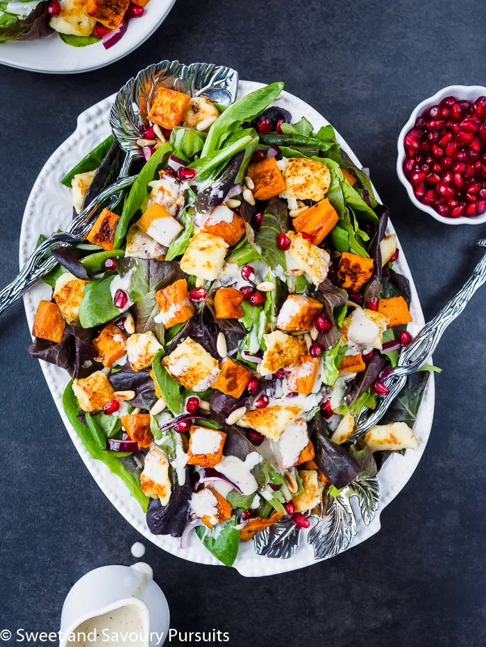 Plate of Roasted Sweet Potato Salad drizzled with Citrus Tahini Dressing