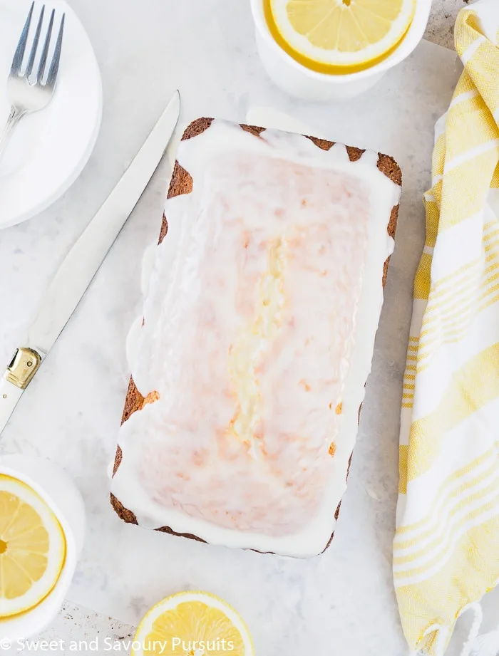 Top view of a glazed lemon loaf cake.