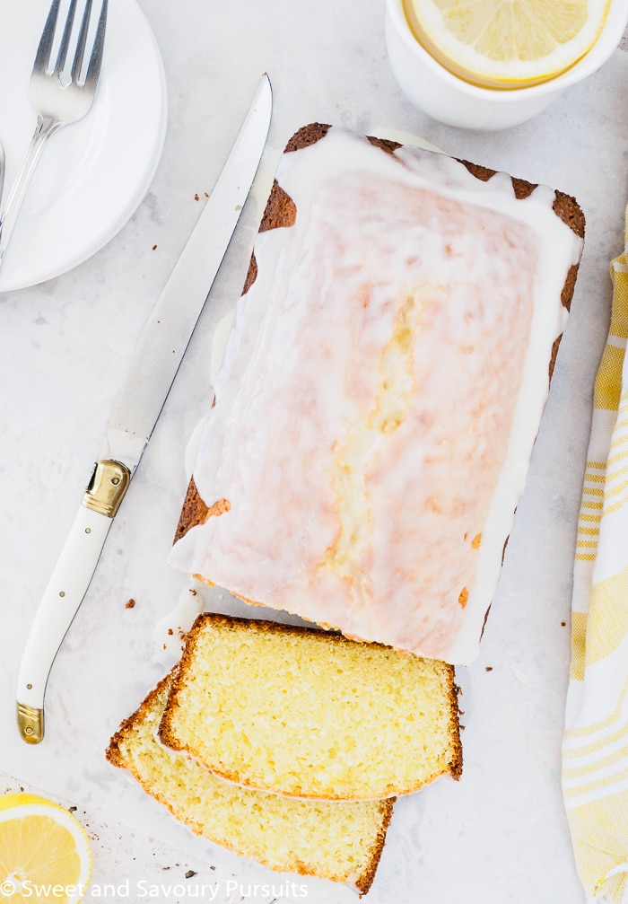 Top view of a sliced lemon loaf cake.