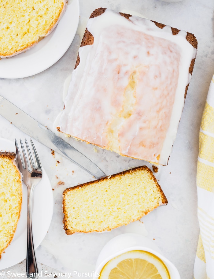 Top view of a sliced glazed lemon bread.