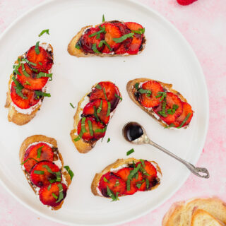 Strawberry Goat Cheese Crostini drizzled with a balsamic reduction.