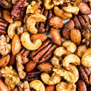 Roasted seasoned nuts on baking tray.