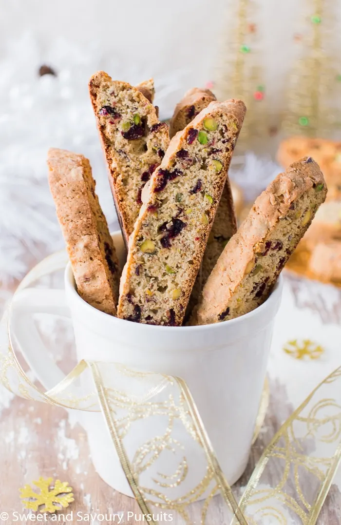 Pistachio and Cranberry Biscotti in white mug.