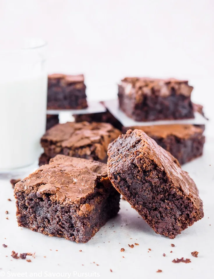 Sliced Gluten-Free Almond Flour Brownies with glass of milk.