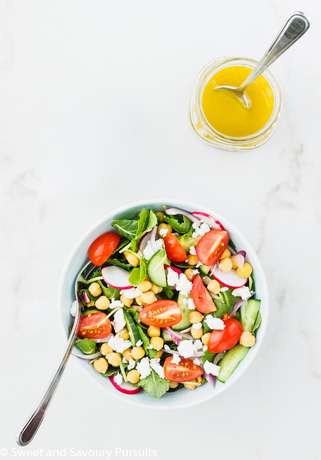 Mediterranean Kale Salad served with lemon garlic dressing on the side.