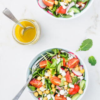Mediterranean Kale Salad served with lemon and garlic salad dressing.