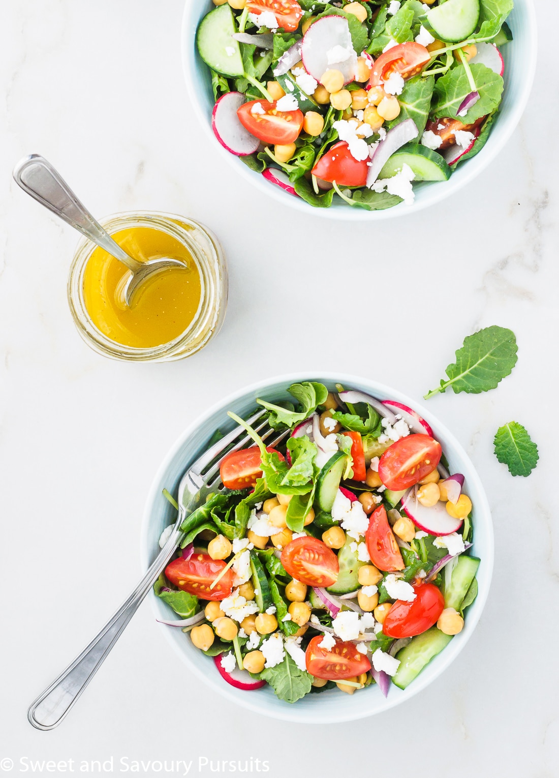 Mediterranean Kale Salad served with lemon and garlic salad dressing.