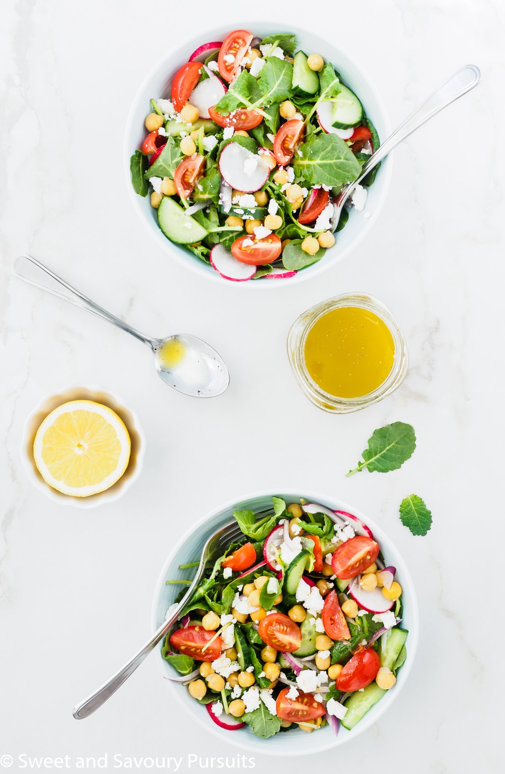 Mediterranean Kale Salad served with lemon garlic dressing on the side.