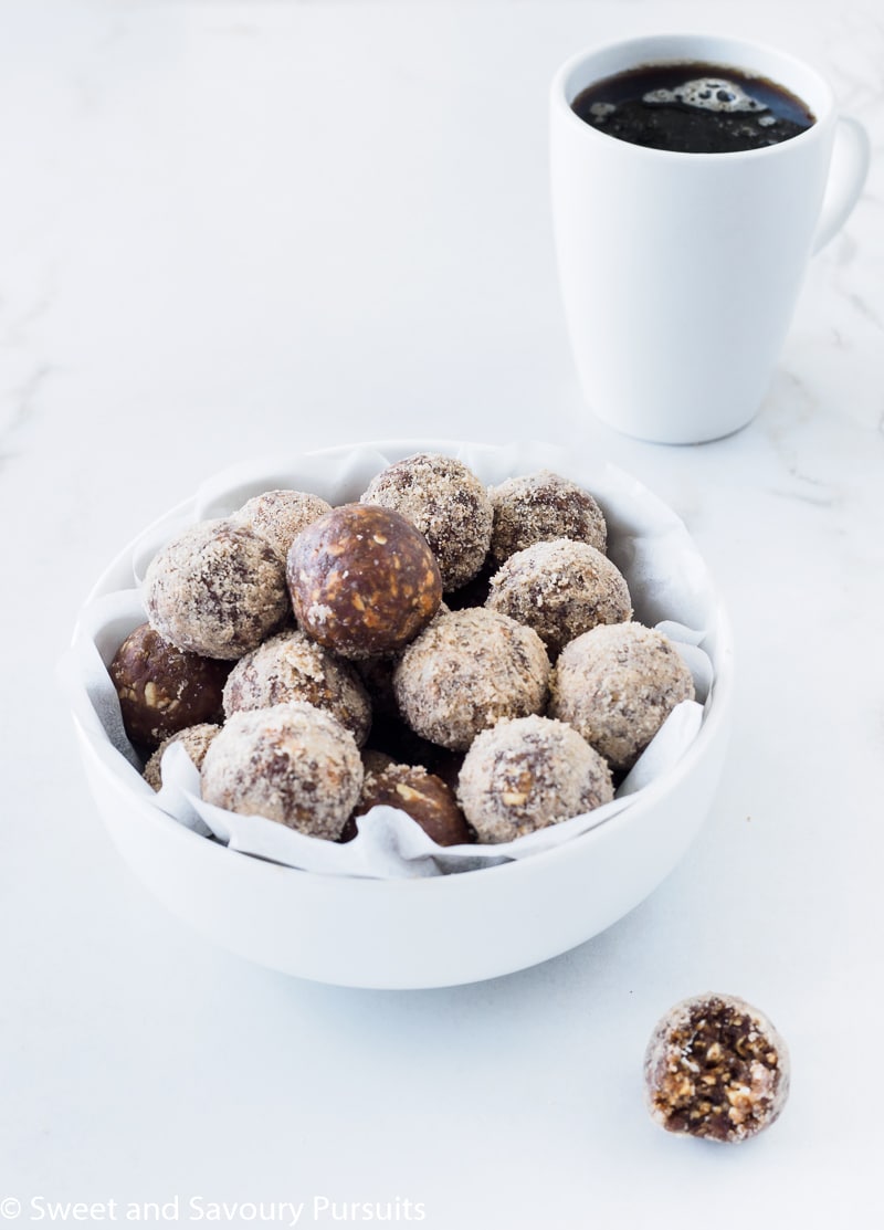 Bowl of No-Bake Maple Espresso Bites served with a cup of coffee.