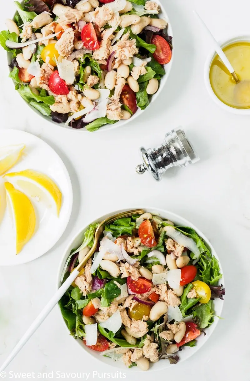 White Bean and Tuna Salad bowls served with a lemon and olive oil vinaigrette on the side.