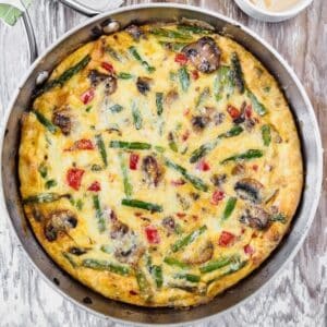 Top view of vegetable frittata in skillet.