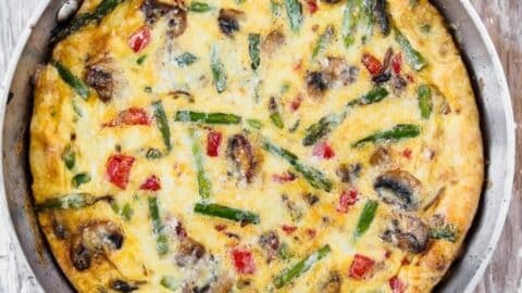 Top view of vegetable frittata in skillet.