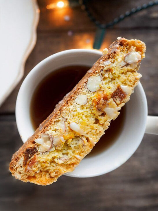 One Apricot and Almond Biscotti on top of cup of tea