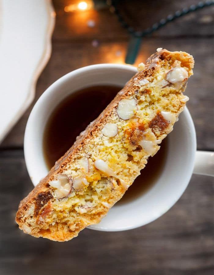 One Apricot and Almond Biscotti on top of cup of tea
