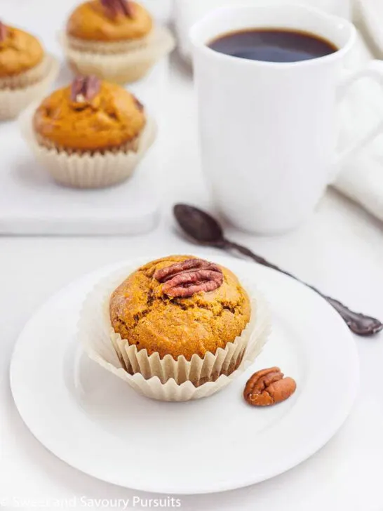 A Sweet Potato Muffin served on a small white dish.