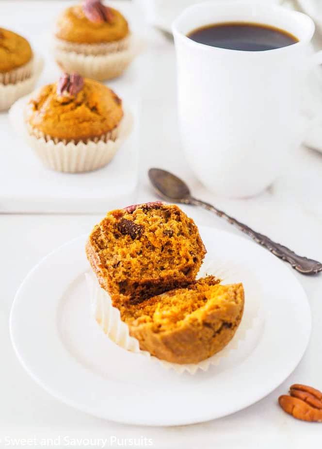 A Sweet Potato Muffin cut in half on small plate.