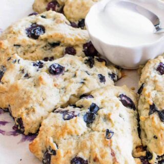 Blueberry and Lemon scones served with icing on the side.