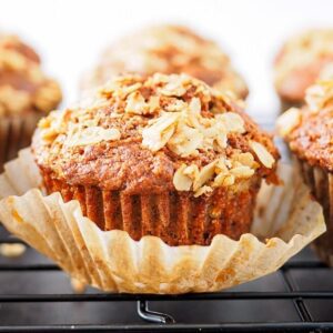 Whole wheat carrot muffins on cooling rack.