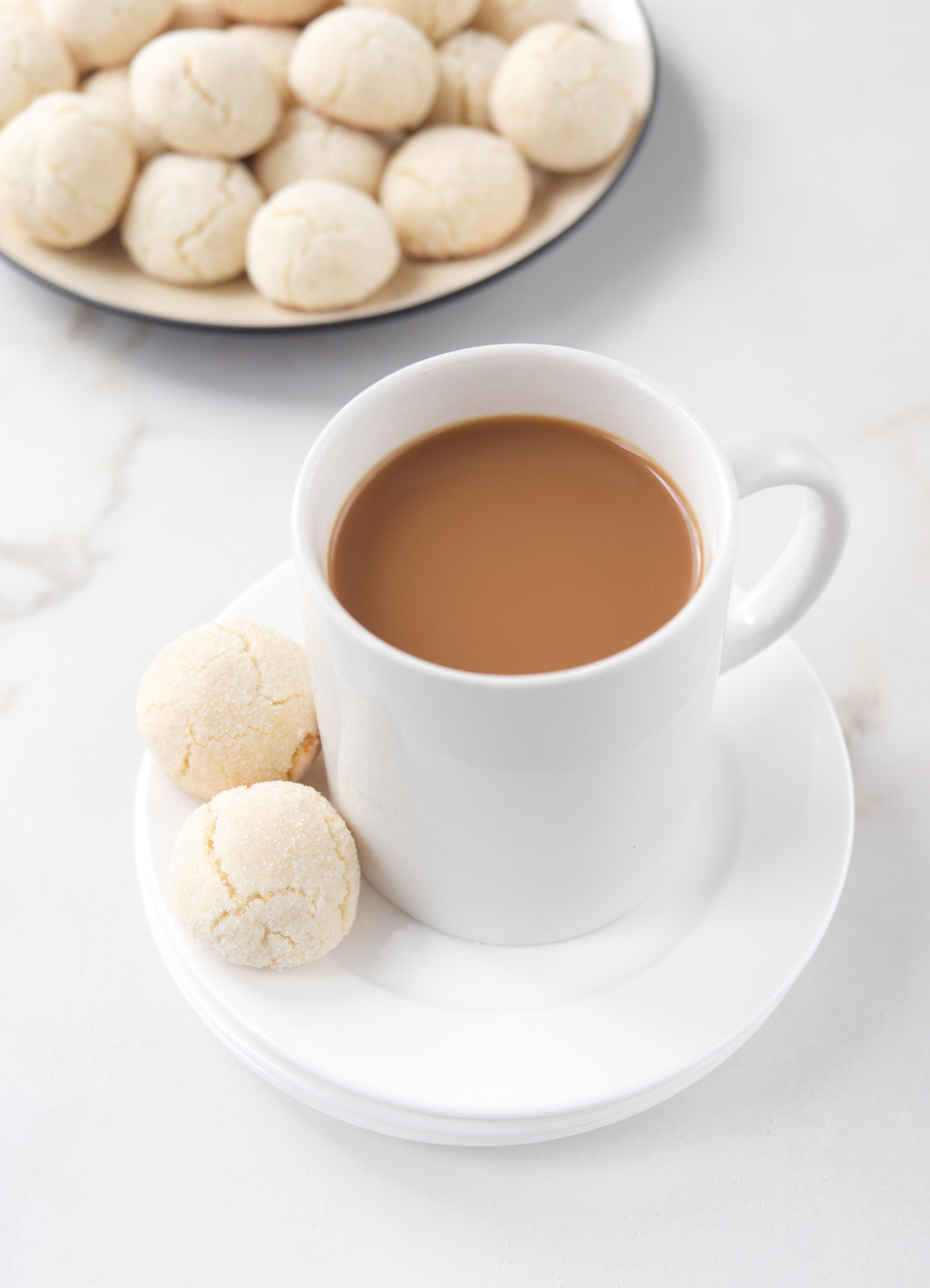 Cup of coffee with amaretti cookies.