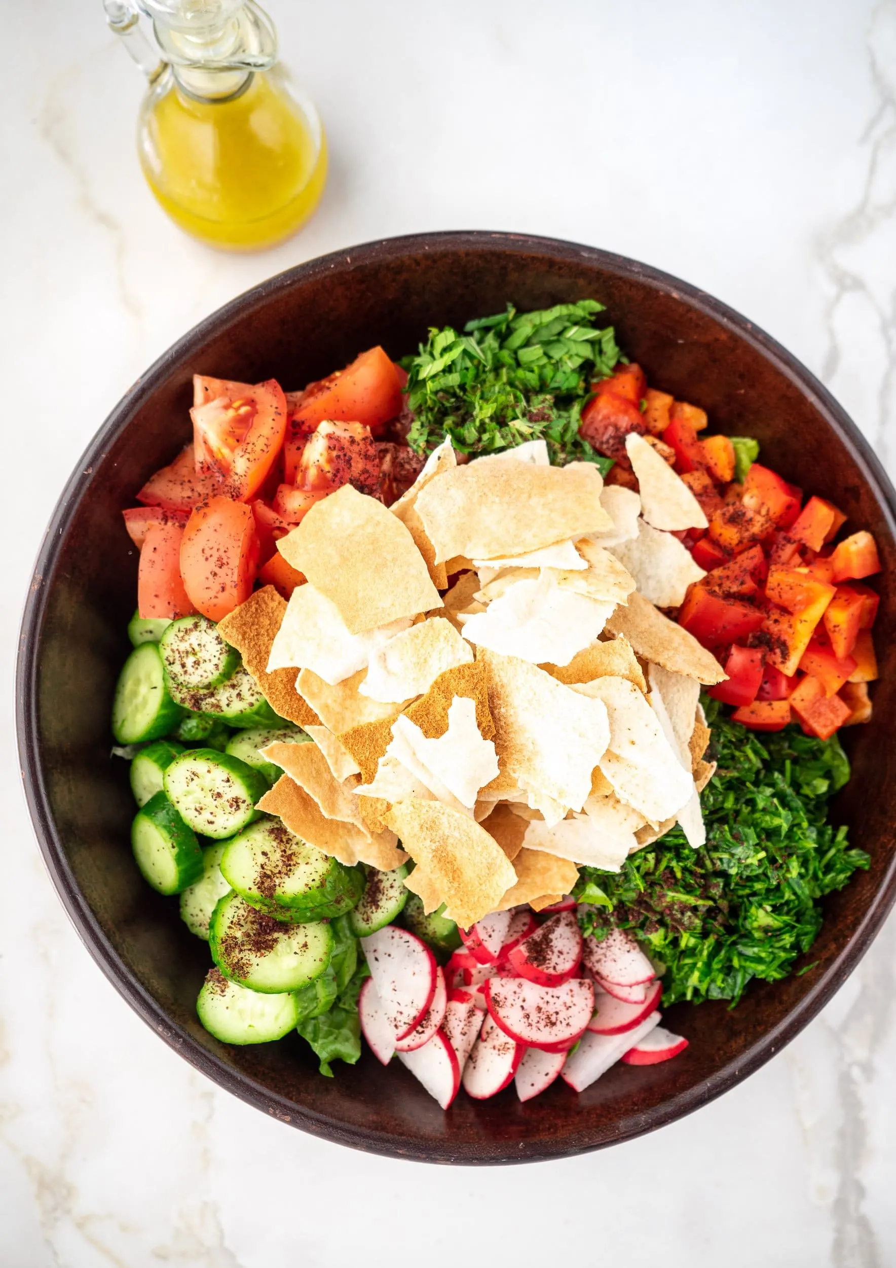 Large bowl containing Fattoush ingredients.