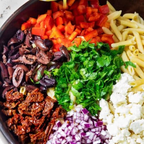 Bowl of Mediterranean pasta salad.