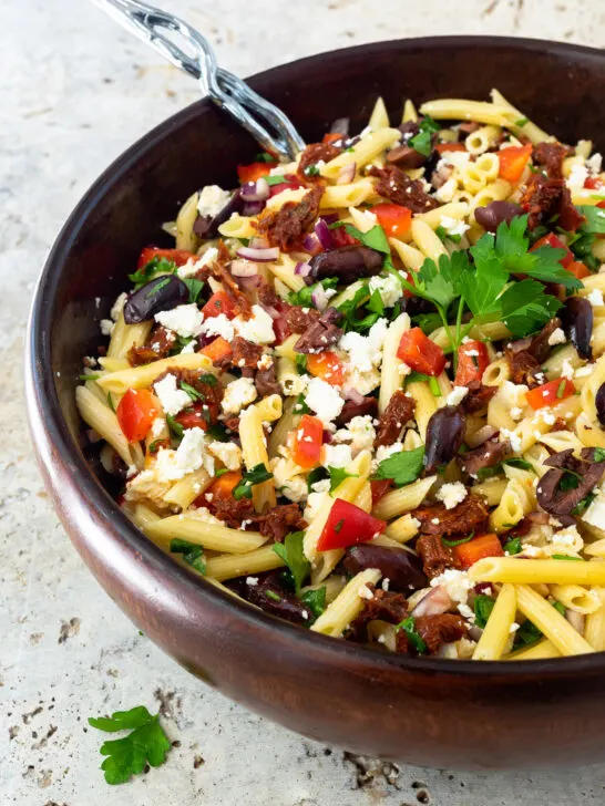 Mediterranean Pasta Salad in a large wooden bowl.