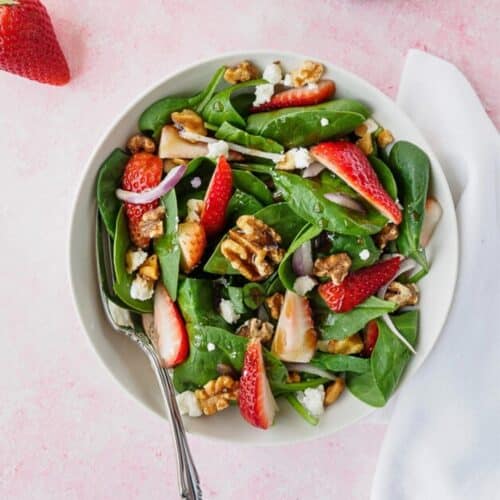 Bowl of strawberry spinach salad.