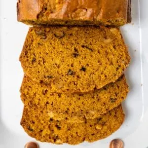 Sliced pumpkin bread on platter.