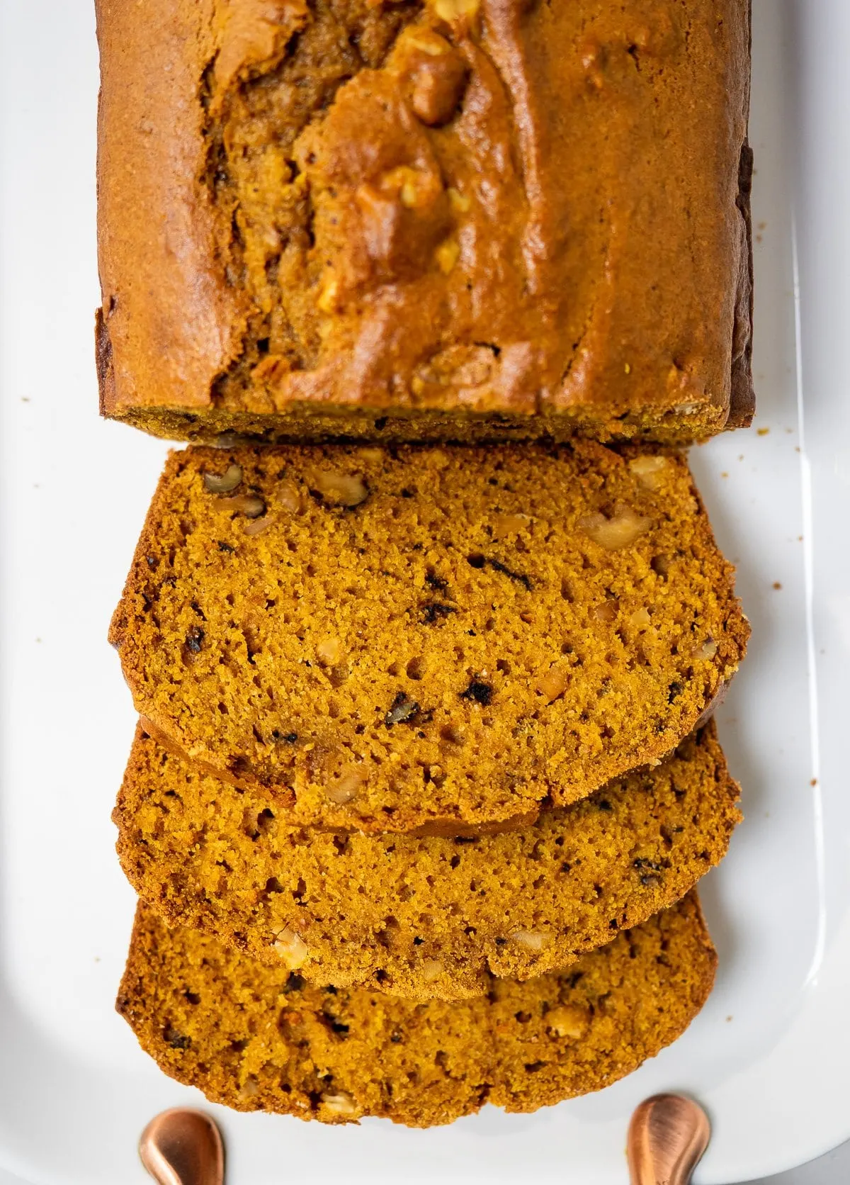 Top view of a partially sliced pumpkin bread.