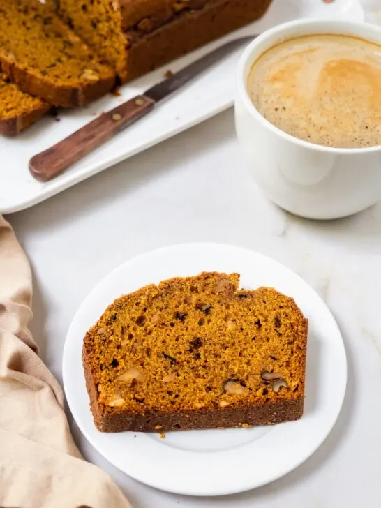Plated slice of a Pumpkin Walnut Loaf