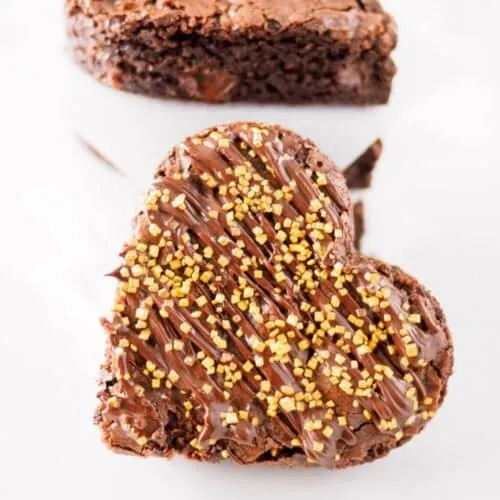 Heart shaped brownie with golden sparkles.