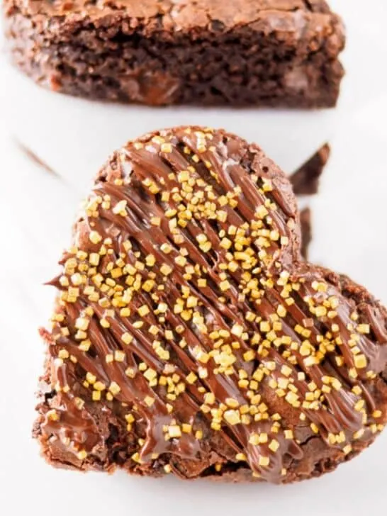 Heart shaped brownie with golden sparkles.