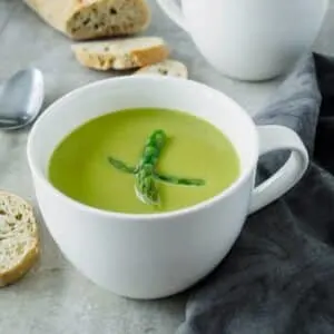 Large mug of creamy asparagus soup.