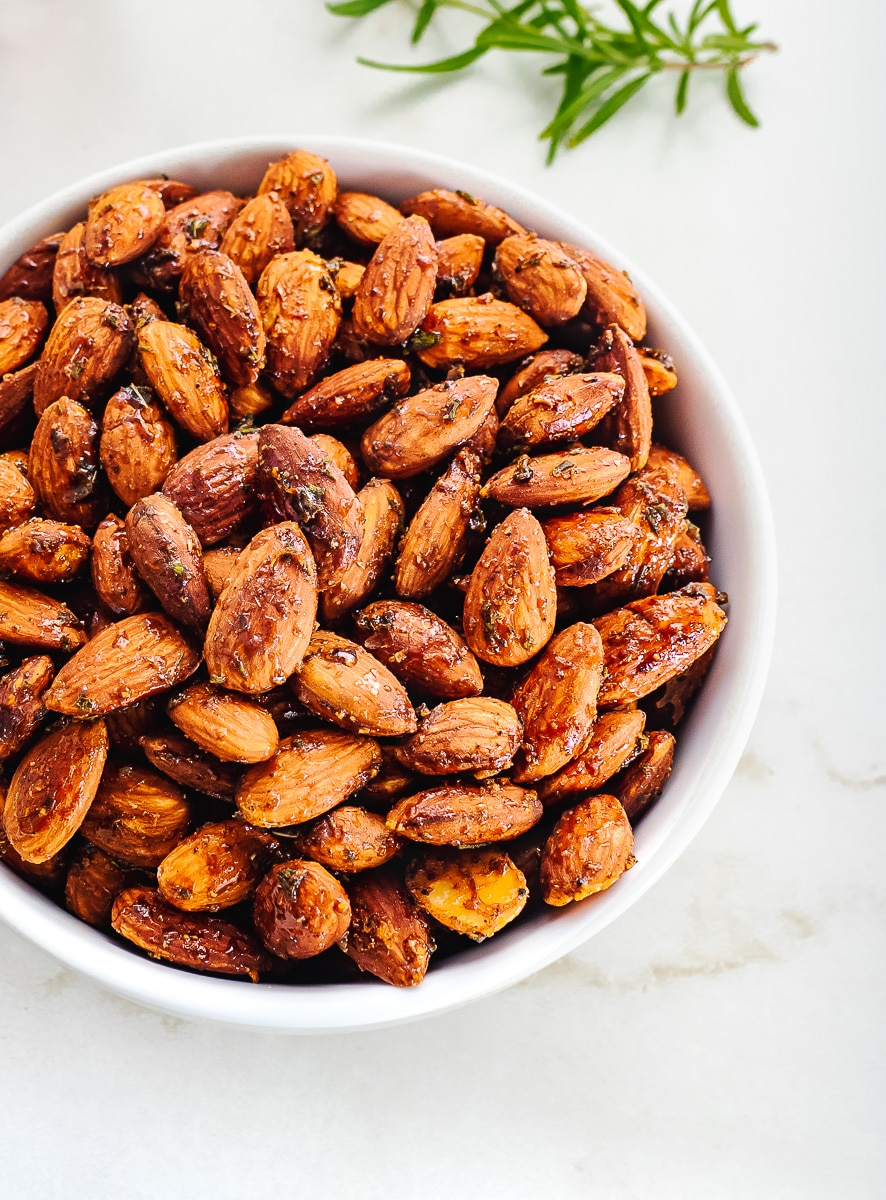 Roasted and seasoned almonds in bowl.