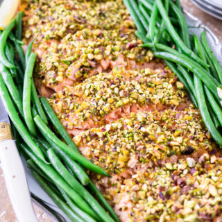 Filet of pistachio crusted salmon on platter.