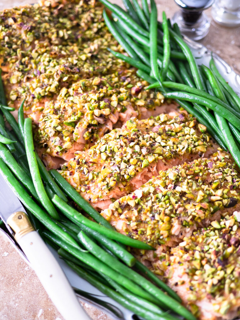 Up-close image of a pistachio-crusted salmon filet.