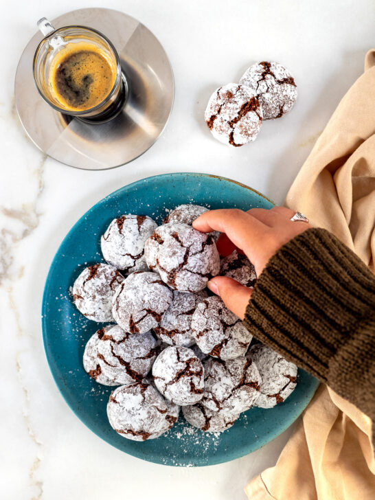 Plate of chocolate amaretti cookies served with an espresso.