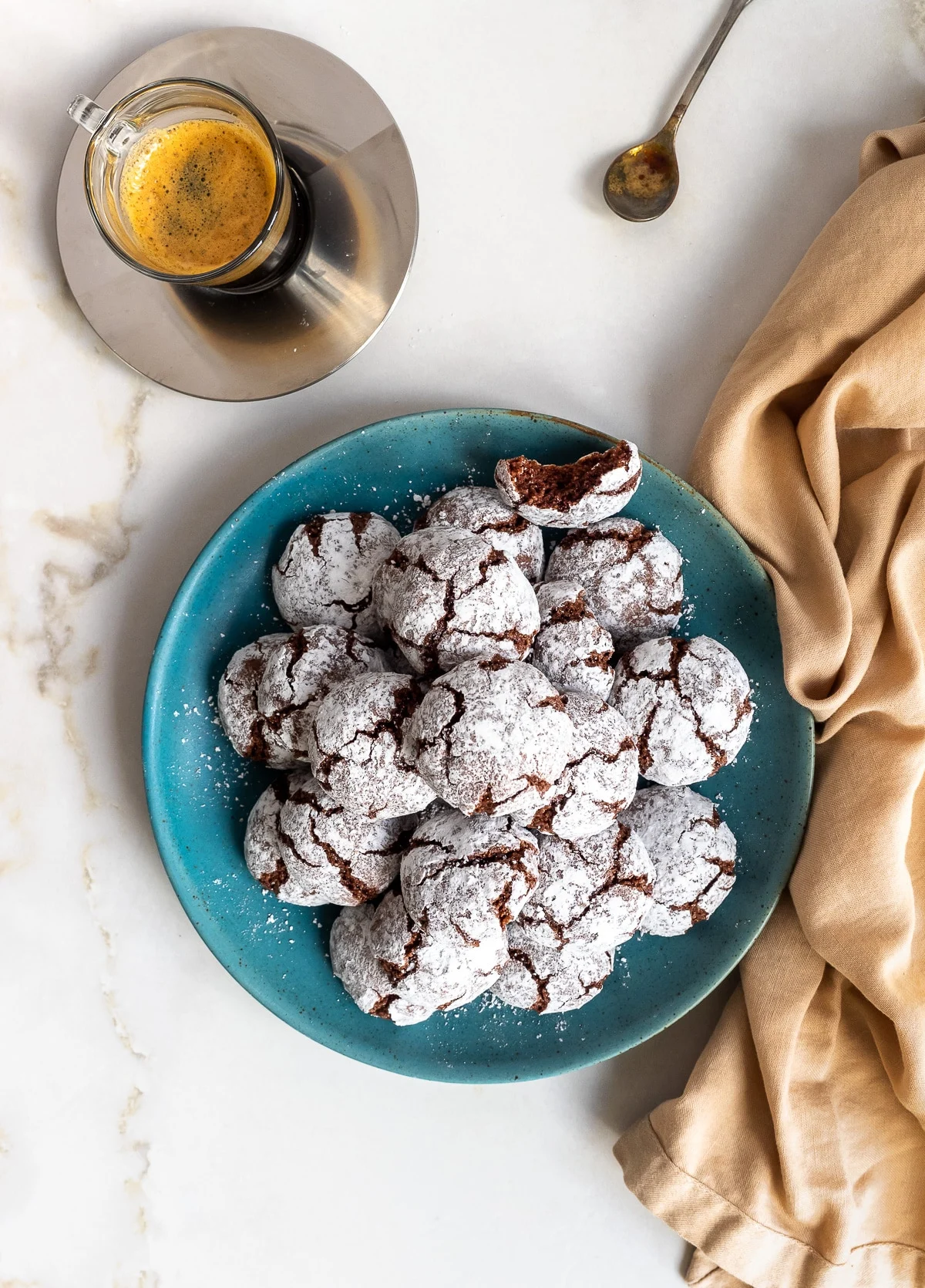 Plate of amaretti cookies served with an espresso.