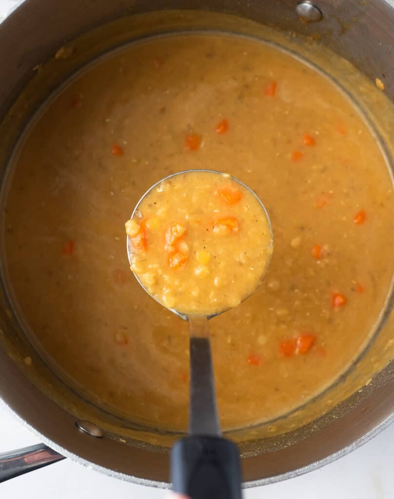 Top view of a pot of cooked Lebanese lentil soup.