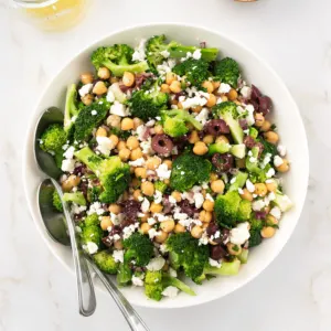 Chickpea broccoli salad in a white bowl.