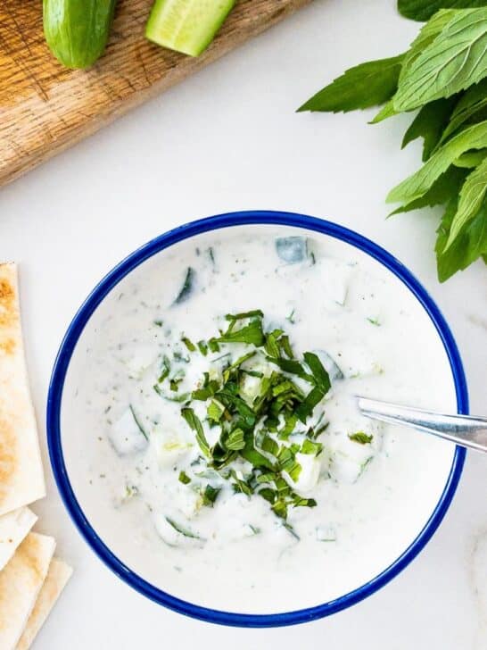 Bowl of cucumber, yogurt and mint salad.