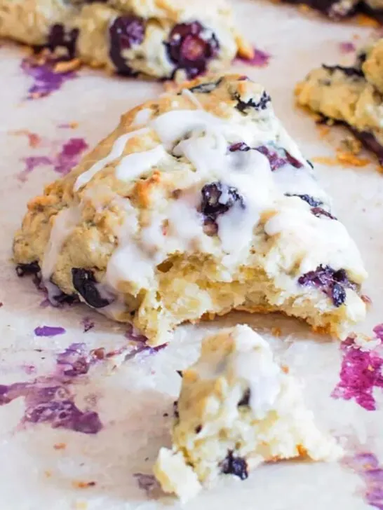 Blueberry lemon scones on baking sheet.