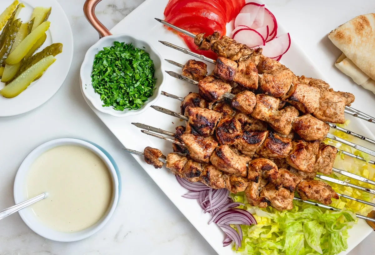 Platter of chicken shawarma kebabs.