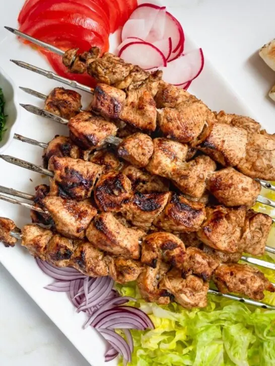 Platter of chicken shawarma skewers.