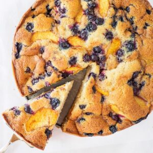 Top view of peach and blueberry cake.